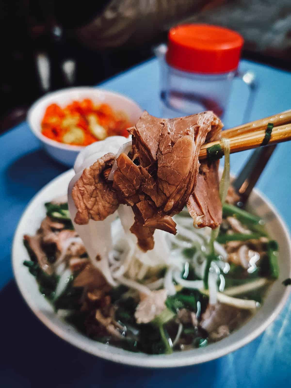 Bowl of pho noodle soup in Hanoi, a national dish and staple food in Vietnam